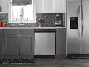 Kitchen interior with a stainless steel dishwasher