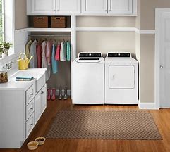 seperated Frigidaire washing and drying units on display in closet