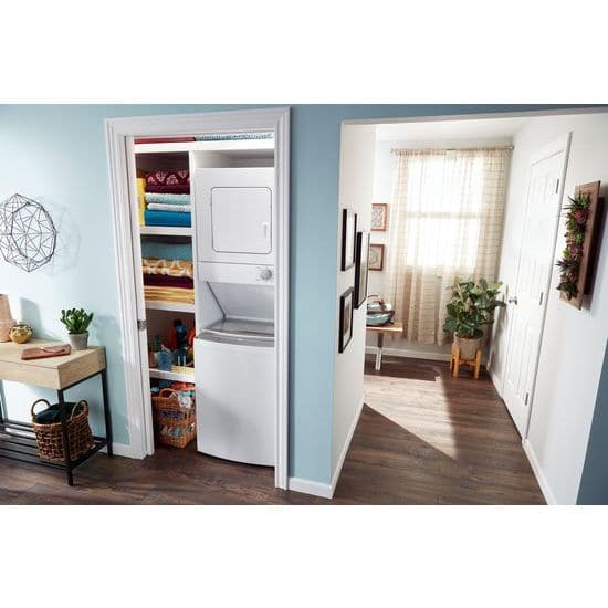 Interior of a house with a stacked washer and dryer setup